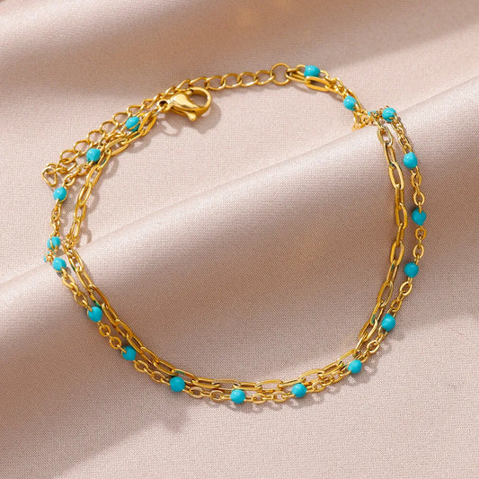 ✨ Double Layer Blue Beads Anklet – Gold Stainless Steel Foot Chain for Women 🔷 خلخال طبقتين مزين بحبيبات زرقاء – سلسلة كاحل من ستانلس ستيل ذهبي للنساء