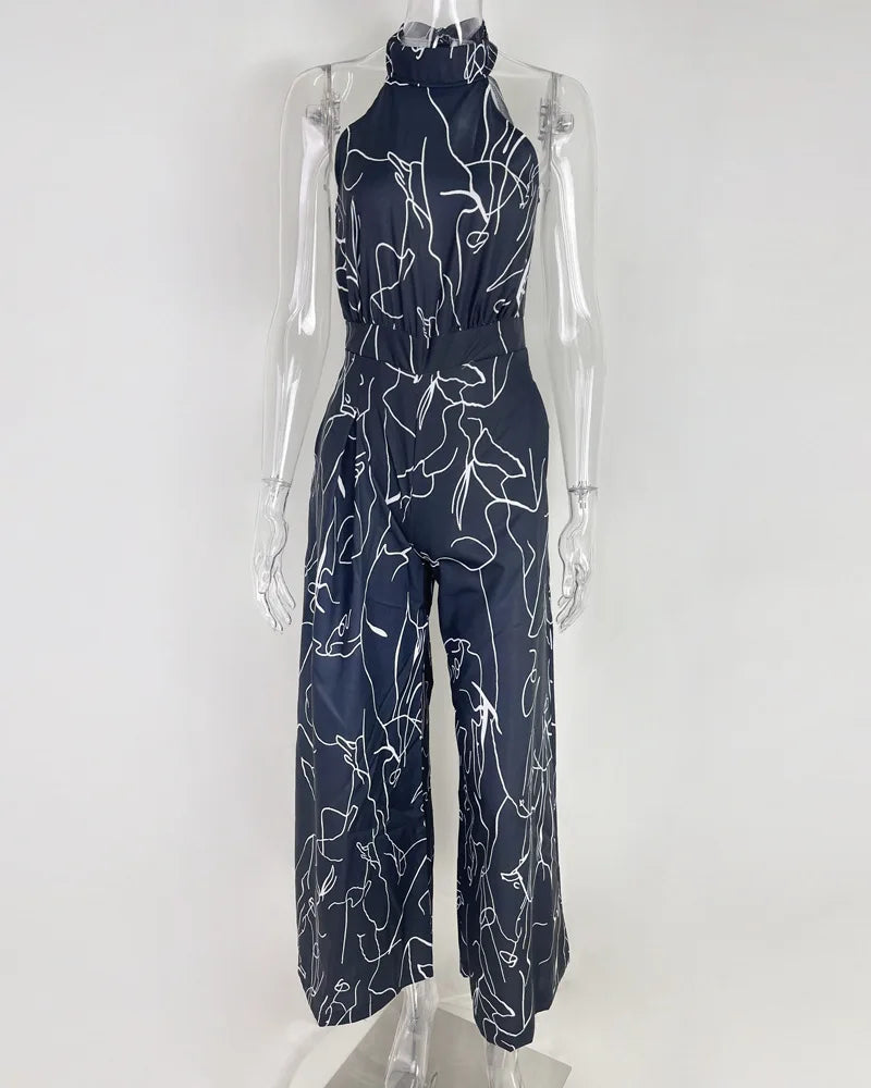 Summer Lace-Up Sleeveless Jumpsuit – Loose Fit with Geometric Print & Pockets | جمبسوت صيفي أنيق بدون أكمام برباط خصر ونقشة هندسية مع جيوب
