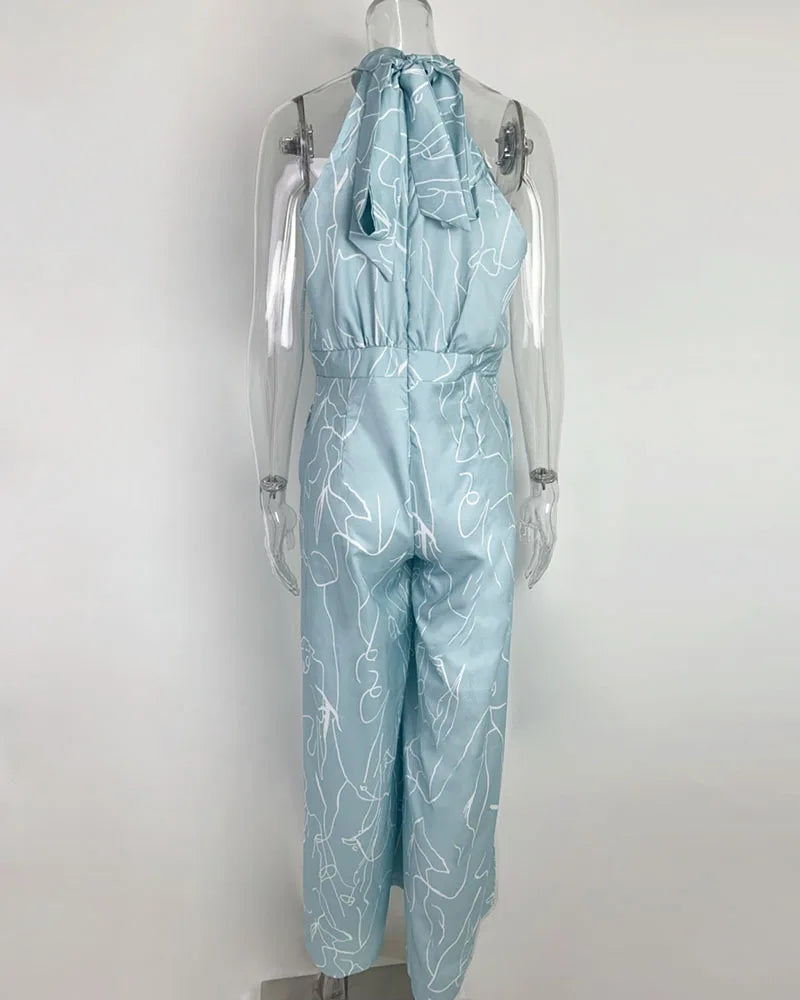 Summer Lace-Up Sleeveless Jumpsuit – Loose Fit with Geometric Print & Pockets | جمبسوت صيفي أنيق بدون أكمام برباط خصر ونقشة هندسية مع جيوب