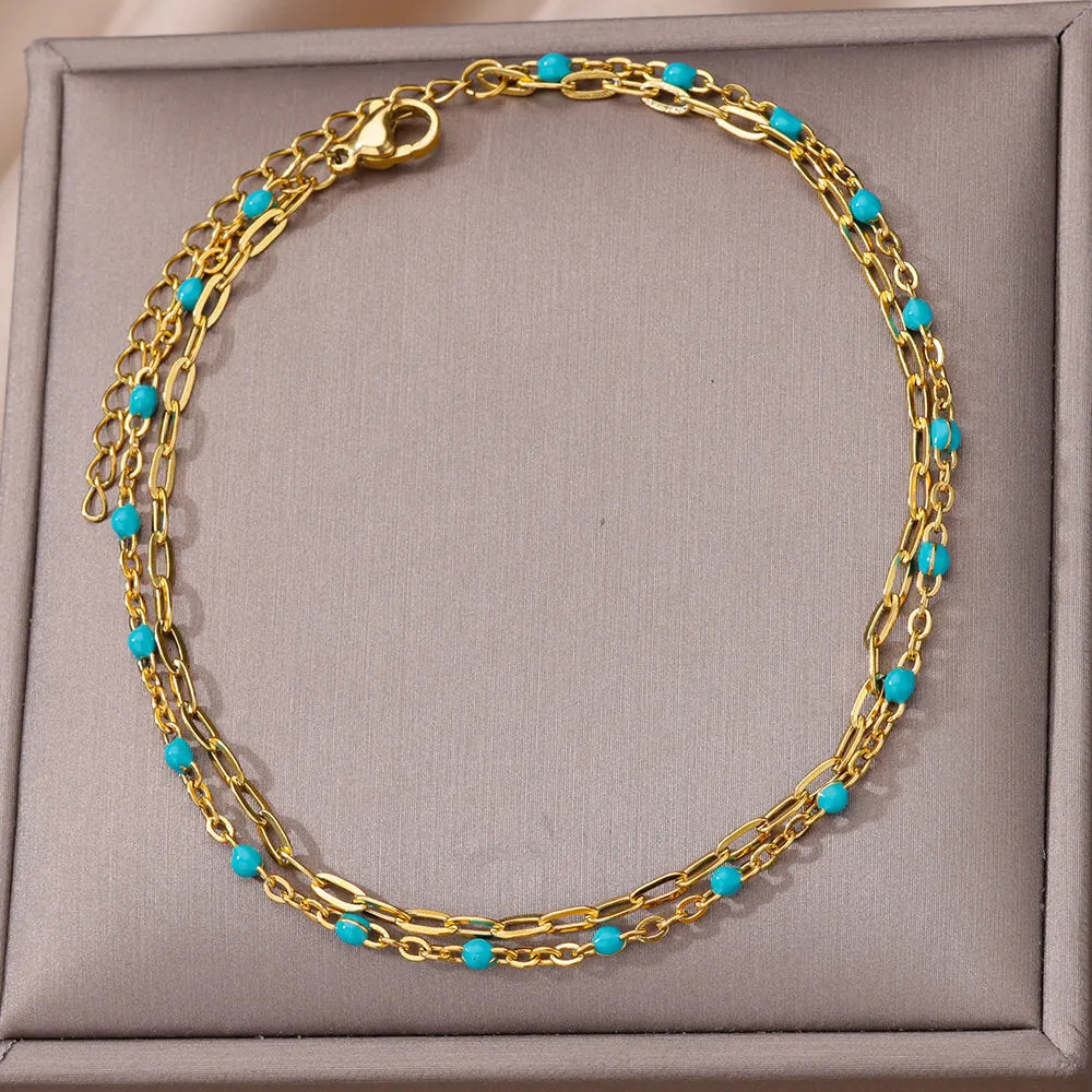 ✨ Double Layer Blue Beads Anklet – Gold Stainless Steel Foot Chain for Women 🔷 خلخال طبقتين مزين بحبيبات زرقاء – سلسلة كاحل من ستانلس ستيل ذهبي للنساء
