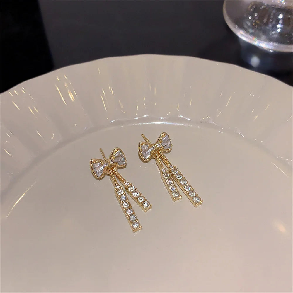 ✨ Fashion Zircon Bow Tassel Earrings 🎀 | أقراط نسائية أنيقة بشكل فيونكة مرصعة بالزركون والكريستال – إكسسوار راقٍ للحفلات والهدايا