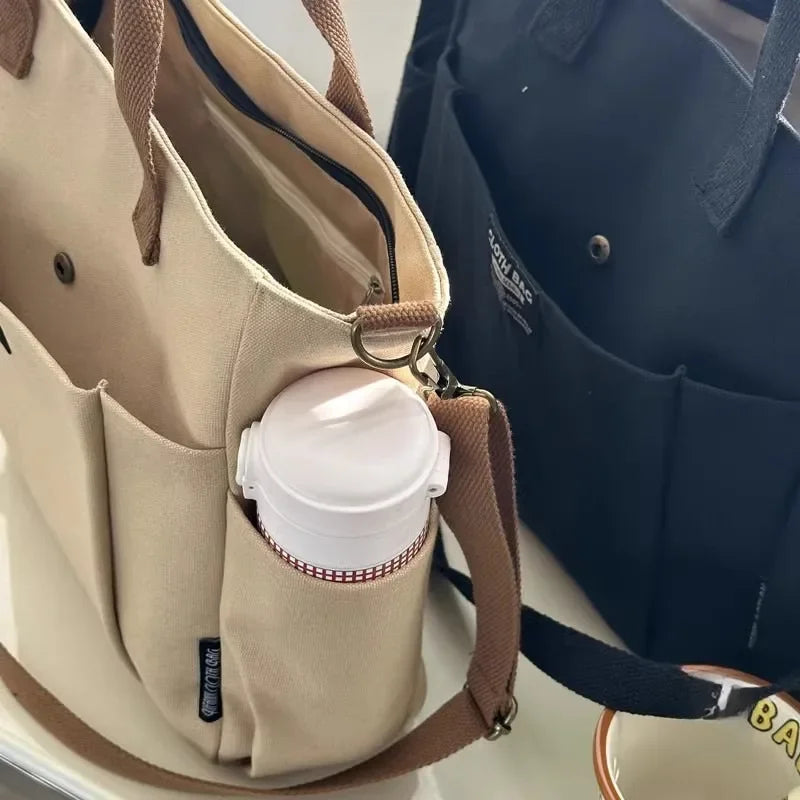 👜 Canvas Women’s Tote Bag – Large-Capacity Casual Shoulder Handbag | حقيبة نسائية قماشية عملية – بتصميم بسيط وسعة كبيرة للجامعة أو العمل