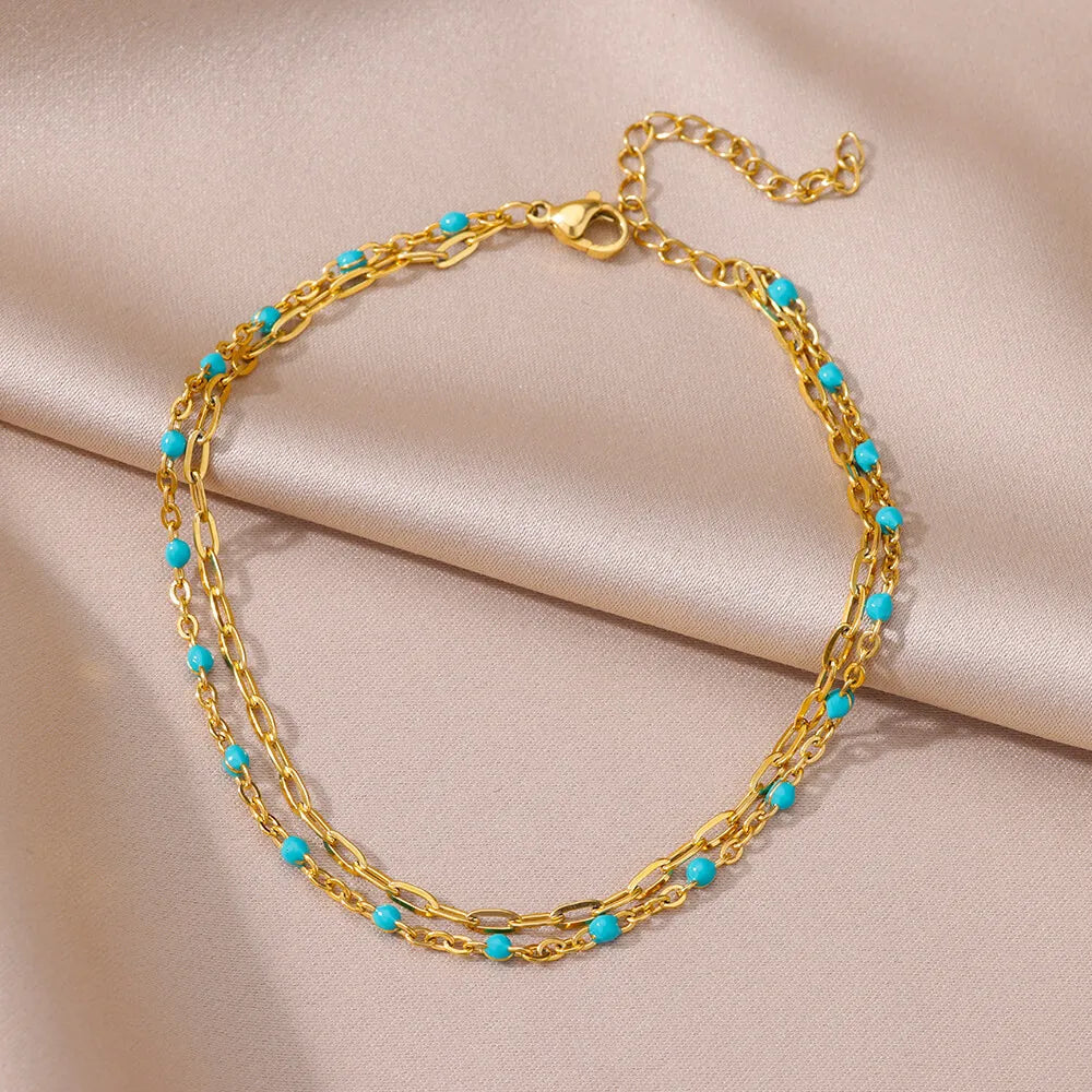 ✨ Double Layer Blue Beads Anklet – Gold Stainless Steel Foot Chain for Women 🔷 خلخال طبقتين مزين بحبيبات زرقاء – سلسلة كاحل من ستانلس ستيل ذهبي للنساء