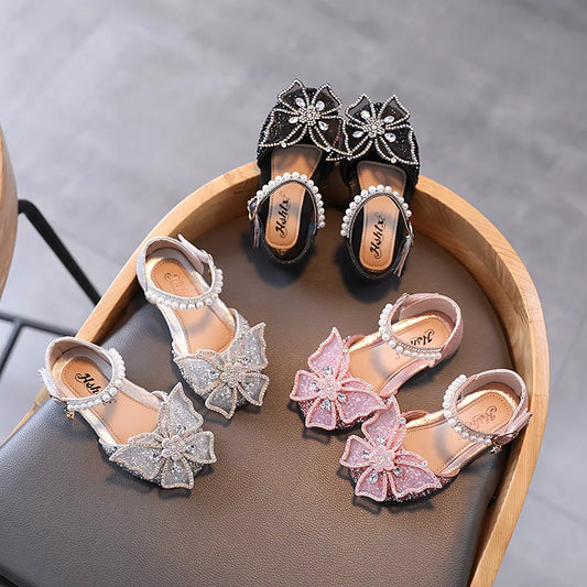 ✨ Girls Princess Sandals – Rhinestone & Sequin Bow Dress Shoes (Flat Heel) | صندل أميرة للبنات – فيونكة لامعة بحبات كريستال وكعب مسطح