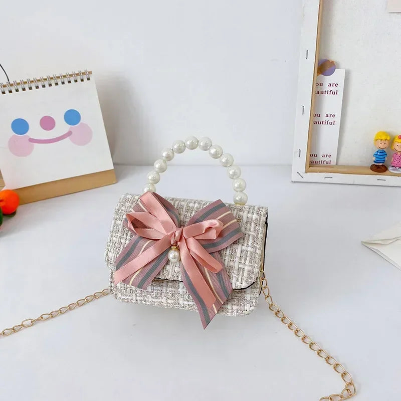 Princess Chanel style chain bag baby pearl accessories hand bell bag trendy children cute bow girl shoulder bag