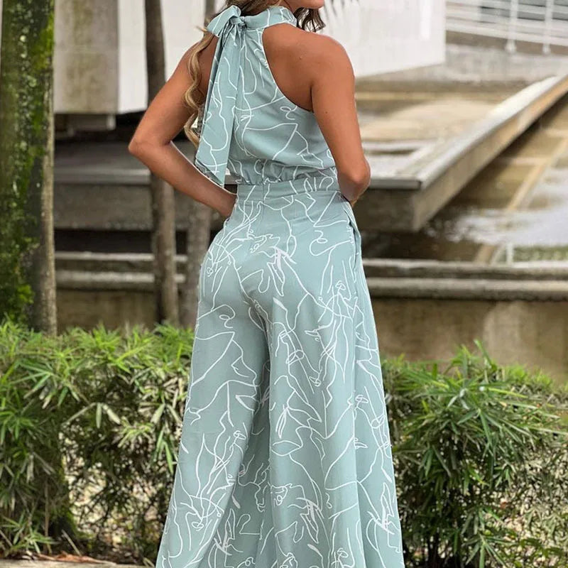 Summer Lace-Up Sleeveless Jumpsuit – Loose Fit with Geometric Print & Pockets | جمبسوت صيفي أنيق بدون أكمام برباط خصر ونقشة هندسية مع جيوب