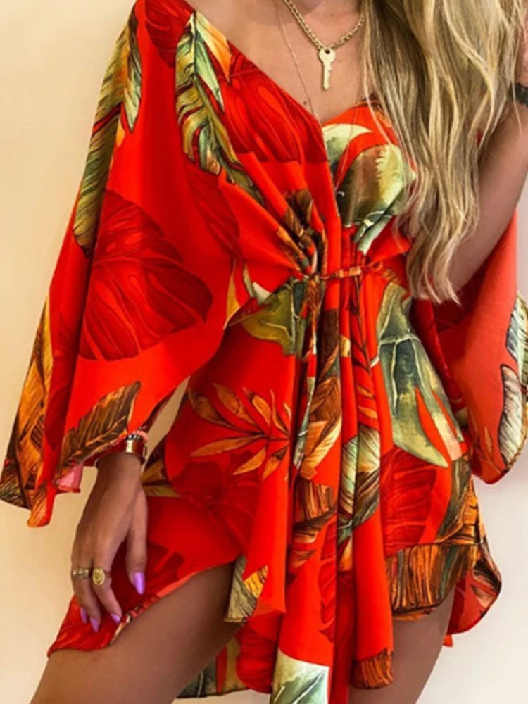 Sexy V-Neck Floral Boho Dress – Asymmetrical Loose Fit with Batwing Sleeves | فستان بوهيمي صيفي واسع بنقشة أوراق وياقة V وأكمام بات وينغ غير متماثل
