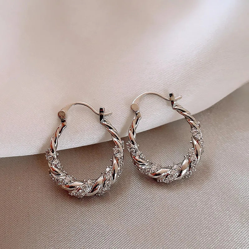 ZAKOL New Unique Shiny Zircon Winding Hoop Earrings for Women Fashion OL Style Gold Color Ear Accessories Party Jewelry
