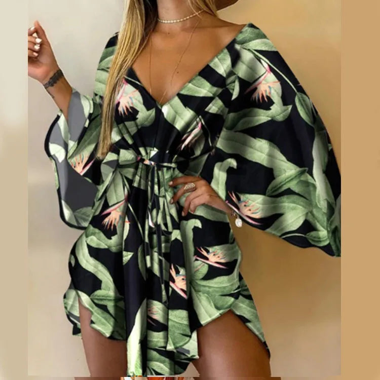 Sexy V-Neck Floral Boho Dress – Asymmetrical Loose Fit with Batwing Sleeves | فستان بوهيمي صيفي واسع بنقشة أوراق وياقة V وأكمام بات وينغ غير متماثل