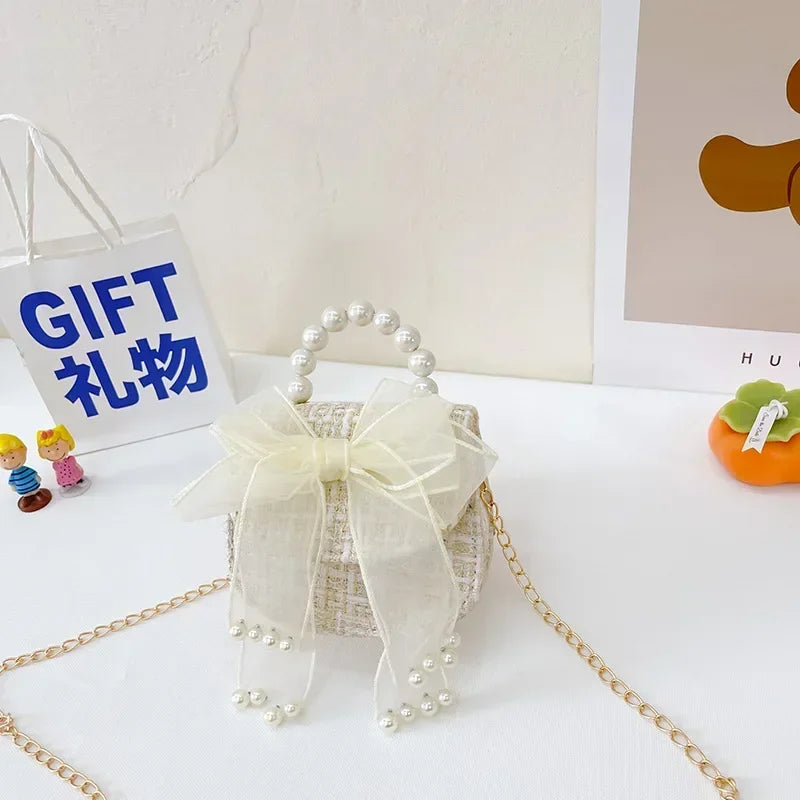 Princess Chanel style chain bag baby pearl accessories hand bell bag trendy children cute bow girl shoulder bag