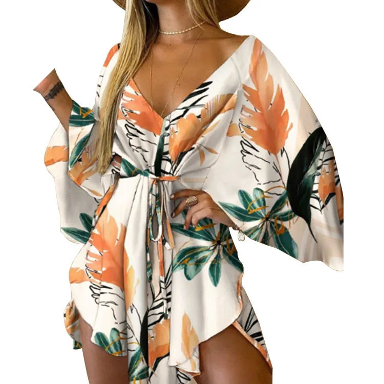 Sexy V-Neck Floral Boho Dress – Asymmetrical Loose Fit with Batwing Sleeves | فستان بوهيمي صيفي واسع بنقشة أوراق وياقة V وأكمام بات وينغ غير متماثل