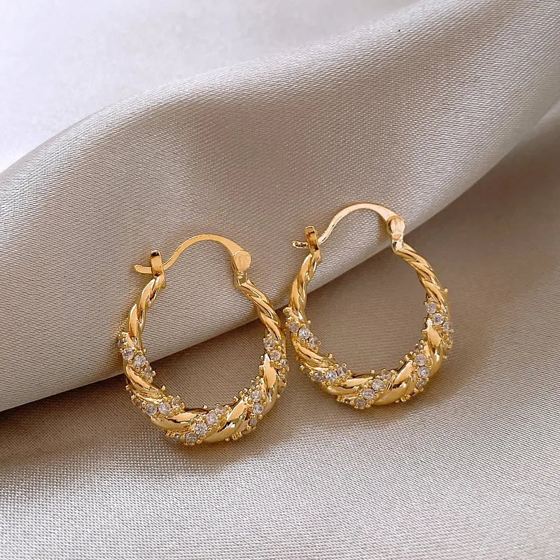 ZAKOL New Unique Shiny Zircon Winding Hoop Earrings for Women Fashion OL Style Gold Color Ear Accessories Party Jewelry