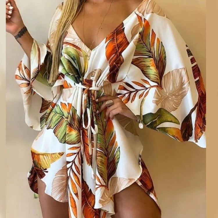 Sexy V-Neck Floral Boho Dress – Asymmetrical Loose Fit with Batwing Sleeves | فستان بوهيمي صيفي واسع بنقشة أوراق وياقة V وأكمام بات وينغ غير متماثل