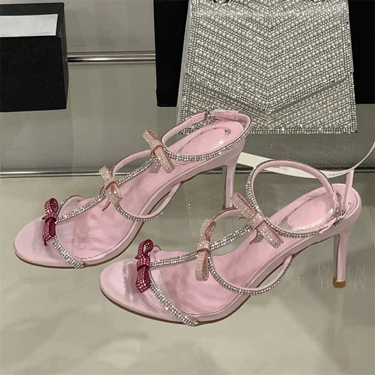 Aneikeh Women’s Crystal Butterfly Knot High Heels – Sexy Peep-Toe Ankle Strap Stiletto Sandals for Banquets & Parties | صندل أنيق من Aneikeh بكعب رفيع ورباط كاحل – تصميم مفتوح مع فيونكة كريستال لحفلات السهرة والمناسبات