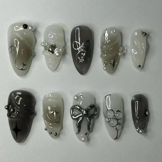 24 قطعة أظافر صناعية بشكل لوزي مع لاصق وديكور فضي – 24Pcs Almond Shape Fake Nails with Glue & Silver Bow Design